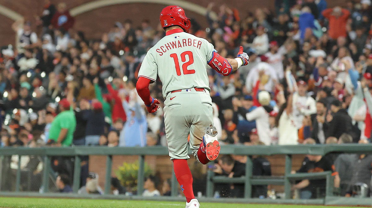 Philadelphia Phillies designated hitter Kyle Schwarber (12) gestures towards fans as he rounds the bases on a two-run home run to bat in pinch hitter Brandon Marsh (16) against the San Francisco Giants during the seventh inning at Oracle Park.