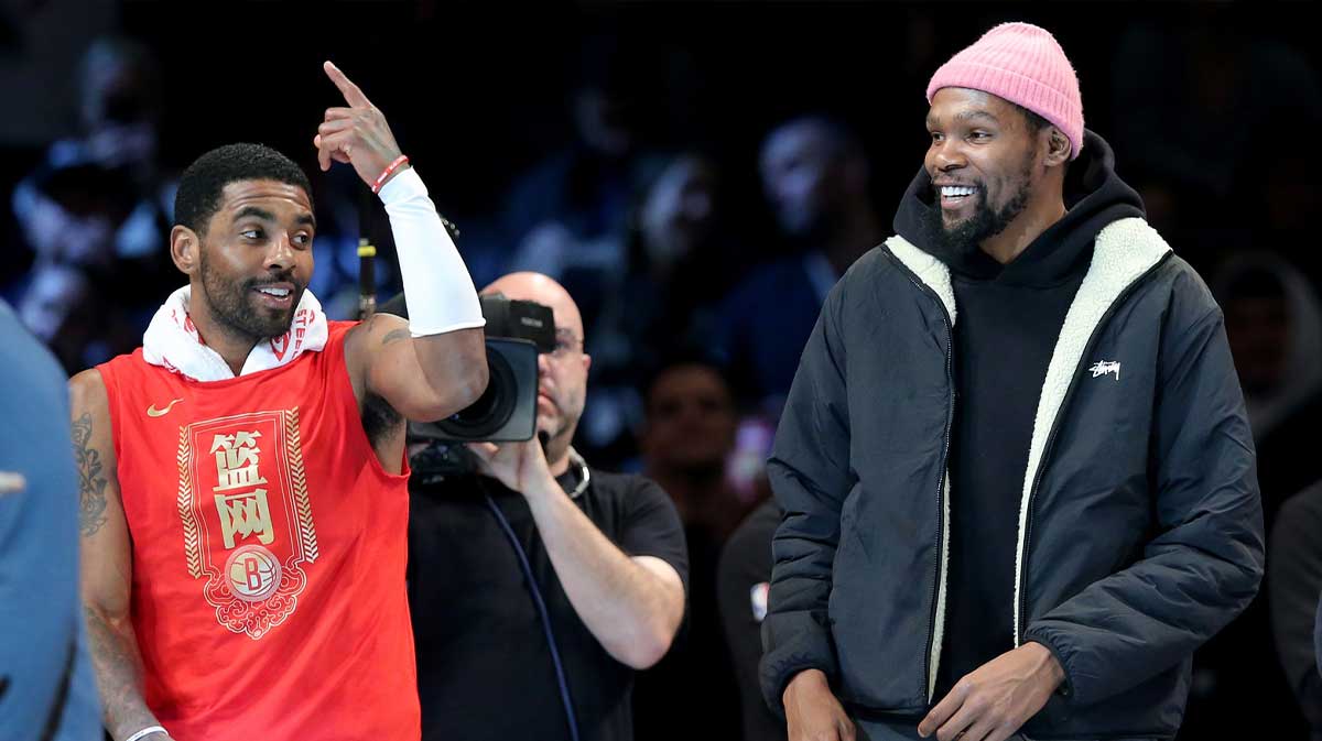 Brooklyn Nets guard Kyrie Irving (11) and forward Kevin Durant (7) react after being announced as 2013 all stars during the second quarter against the Detroit Pistons at Barclays Center.
