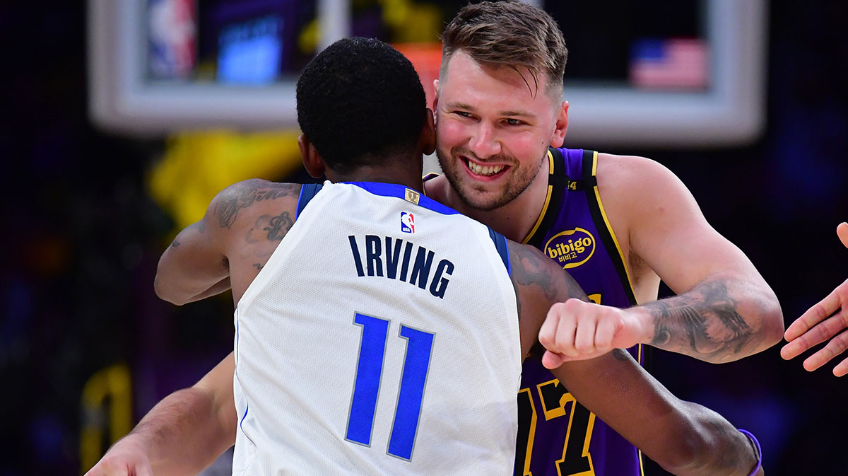 Los Angeles Lakers guard Luka Doncic (77) reacts with Dallas Mavericks guard Kyrie Irving (11) during the first quarter at Crypto.com Arena.