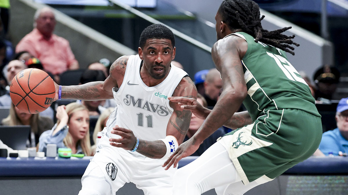 Dallas Mavericks guard Kyrie Irving (11) drives to the basket as Milwaukee Bucks forward Taurean Prince (12) defends during the first half at American Airlines Center.