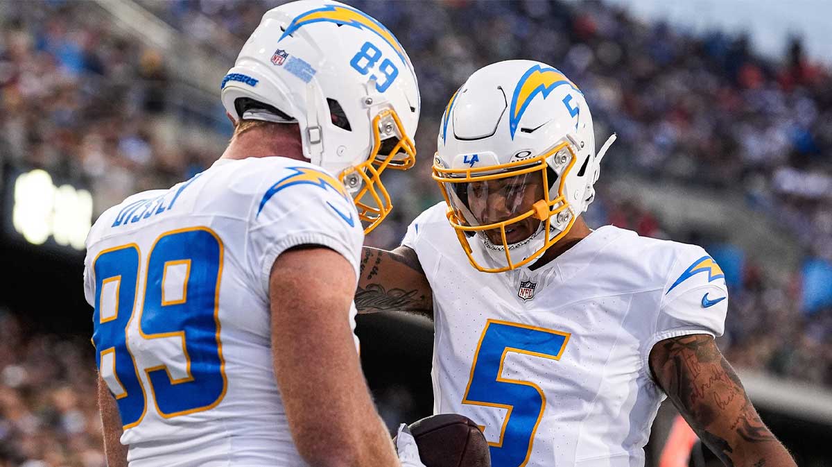 LA Chargers tight end Will Dissly (89) celebrates a touchdown against Detroit Lions with quarterback Trey Lance (5) during the first half of the Hall of Fame Game at Tom Benson Hall of Fame Stadium in Canton, Ohio on Thursday, July 31, 2025.