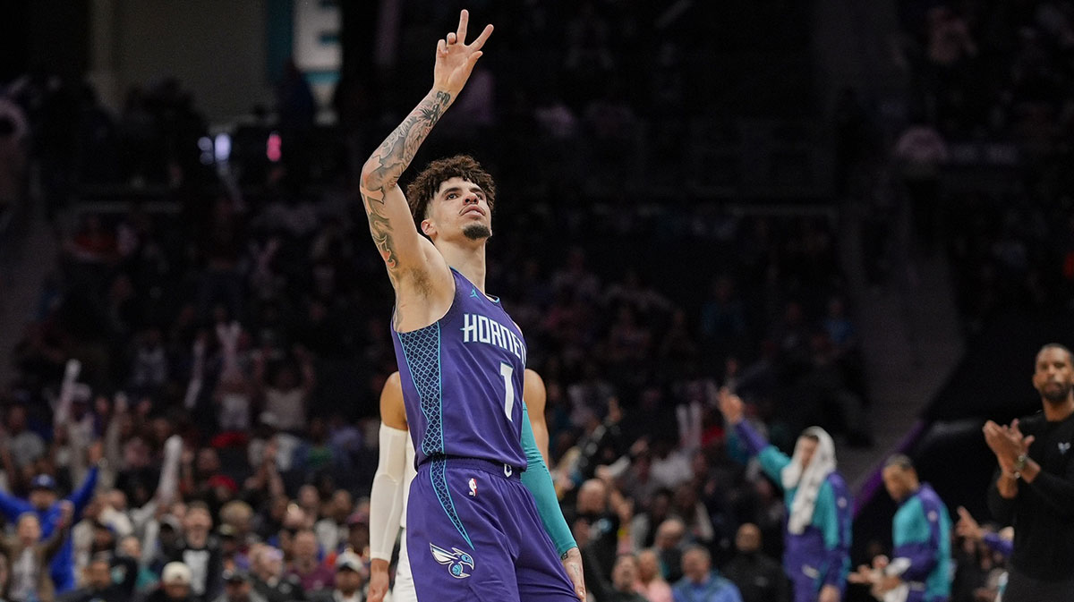 Charlotte Hornets guard LaMelo Ball (1) signals for his three point shot against the New York Knicks during the second half at Spectrum Center.