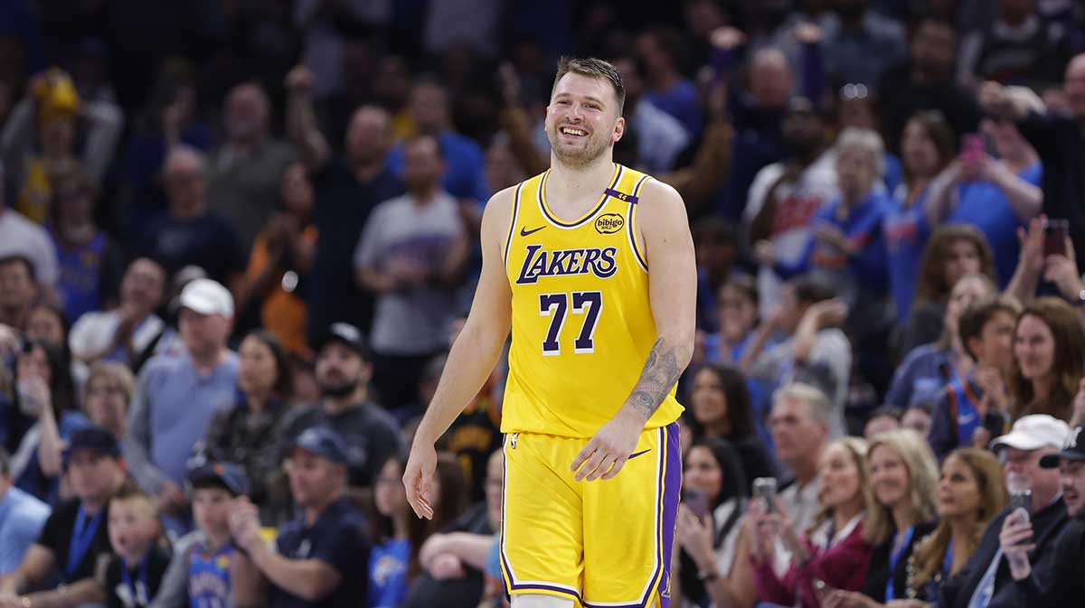 Los Angeles Lakers guard Luka Doncic (77) smiles after a technical is called against him during the second half of a game against the Oklahoma City Thunder at Paycom Center.