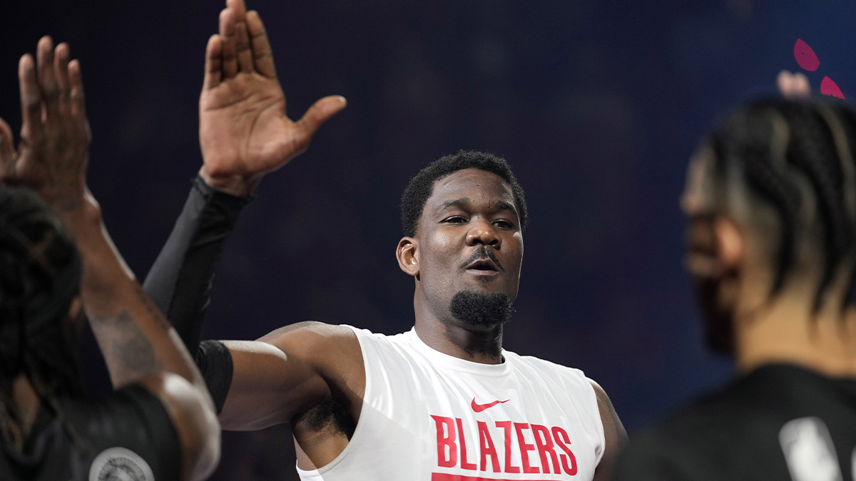 Blazers center Deandre Ayton (2) is introduced before the game against the Phoenix Suns at Moda Center with Kendrick Perkins in the background