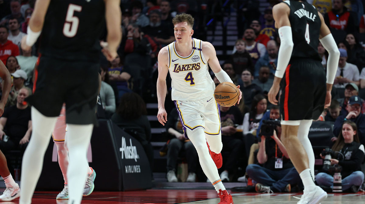 Los Angeles Lakers guard Dalton Knecht (4) brings the ball up the court against the Portland Trail Blazers in the second half at Moda Center. Dalton Knecht suited up for the Lakers in the NBA Summer League.