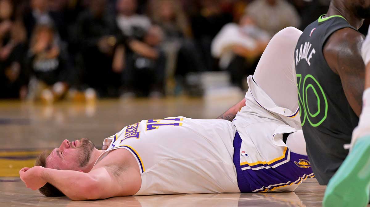 Los Angeles Lakers guard Luka Doncic (77) reacts after a collision with Minnesota Timberwolves forward Julius Randle (30) in the second half at Crypto.com Arena.