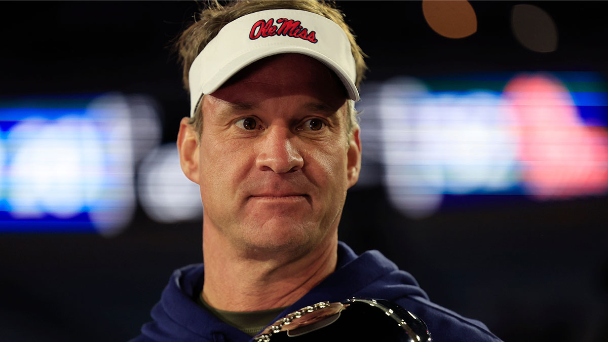 Mississippi Rebels head coach Lane Kiffin is interviewed after the game while holding the Ash Verlander Champions Trophy of the TaxSlayer Gator Bowl Thursday, Jan. 2, 2025 at EverBank Stadium in Jacksonville, Fla. Ole Miss defeated Duke 52-20.