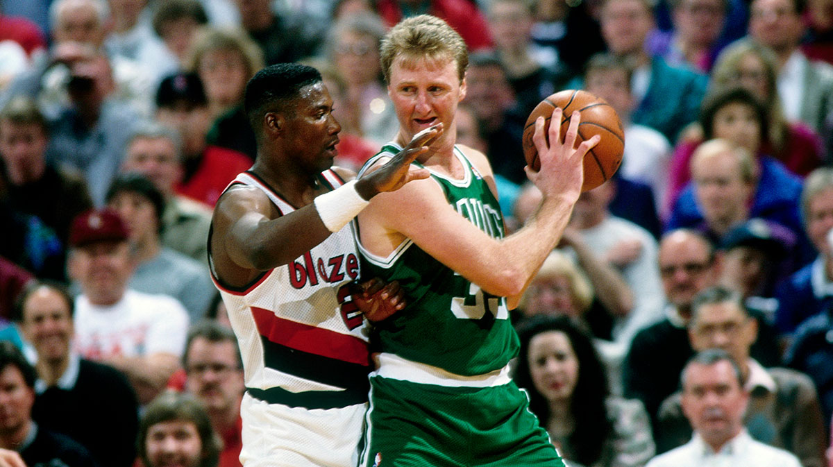 Boston Celtics forward Larry Bird (33) is defended by Portland Trail Blazers forward Jerome Kersey (25) at Memorial Coliseum.