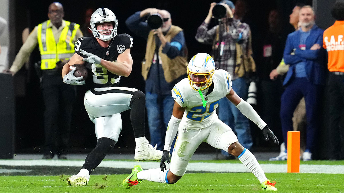 Las Vegas Raiders tight end Brock Bowers (89) slips the tackle of Los Angeles Chargers cornerback Tarheeb Still (29) during the fourth quarter at Allegiant Stadium.