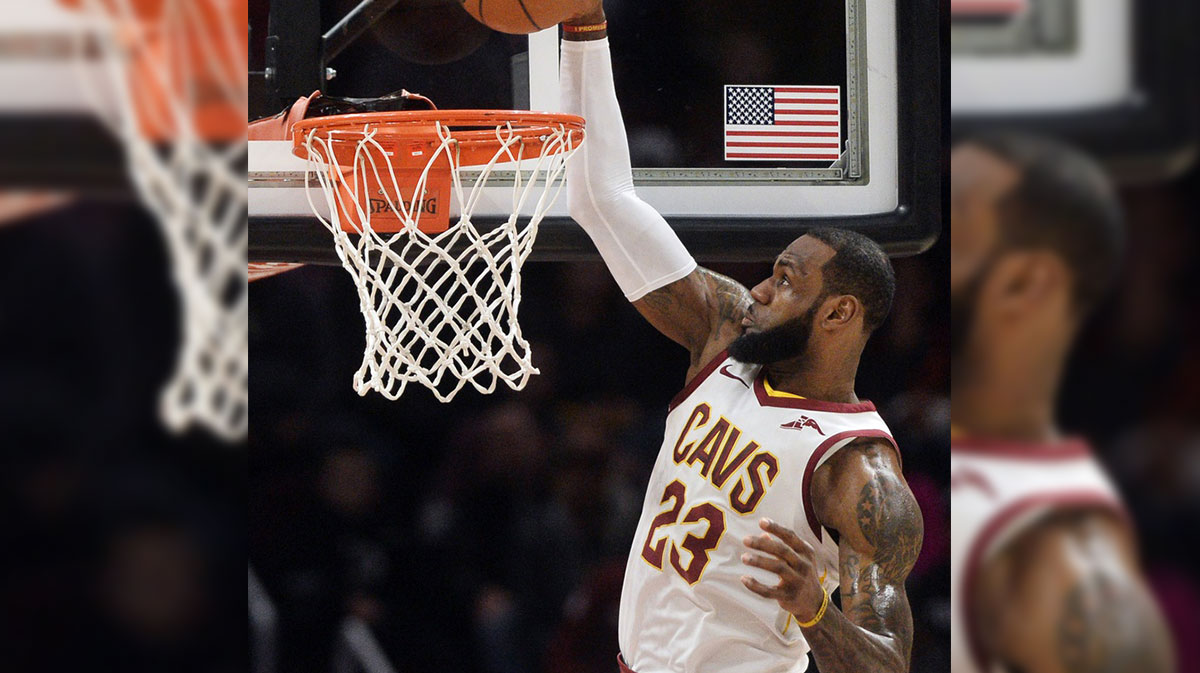 Cleveland Cavaliers forward LeBron James (23) slam dunks during the first half against the Orlando Magic at Quicken Loans Arena.