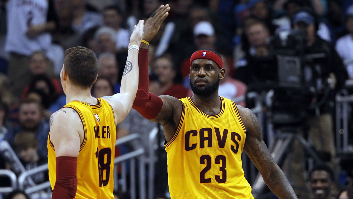 Cleveland Cavaliers forward LeBron James (23) is congratulated by forward Mike Miller (18) after he made a shot during the fourth quarter against the Orlando Magic at Amway Center. Cleveland Cavaliers defeated the Orlando Magic 98-89.