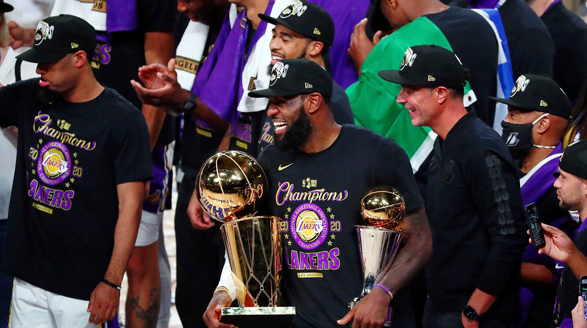 Los Angeles Lakers forward LeBron James (23) smiles while holding the MVP and Finals trophy after game six of the 2020 NBA Finals at AdventHealth Arena. The Los Angeles Lakers won 106-93 to win the series. 
