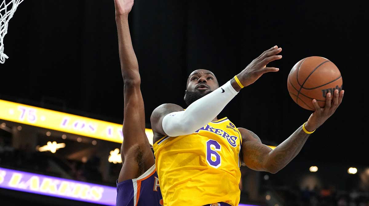 Los Angeles Lakers forward LeBron James (6) shoots against Phoenix Suns forward Mikal Bridges (25) during a preseason game at T-Mobile Arena.