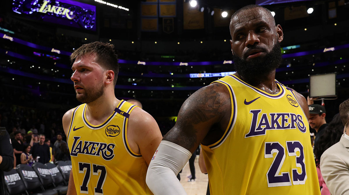 Los Angeles Lakers guard Luka Doncic (77) and Los Angeles Lakers forward LeBron James (23) leave a court after defeating the Minnesota Timberwolves 94-85 in game two of first round for the 2024 NBA Playoffs at Crypto.com Arena.