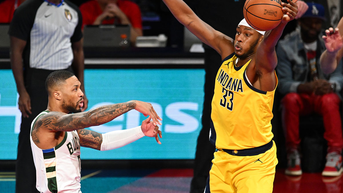 Indiana Pacers center Myles Turner (33) gets a hand on a pass by Milwaukee Bucks guard Damian Lillard (0) during the first quarter at T-Mobile Arena