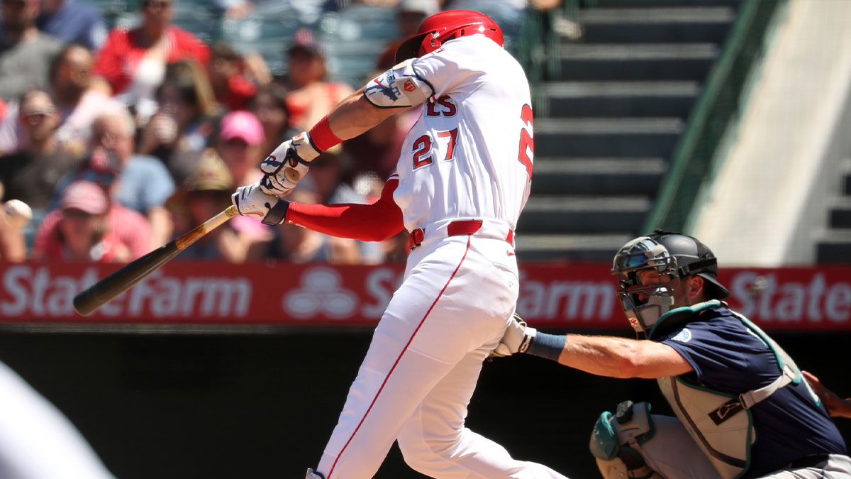 Los Angeles Angels designated hitter Mike Trout (27) hits a 2-run home run during the fifth inning against the Seattle Mariners at Angel Stadium.