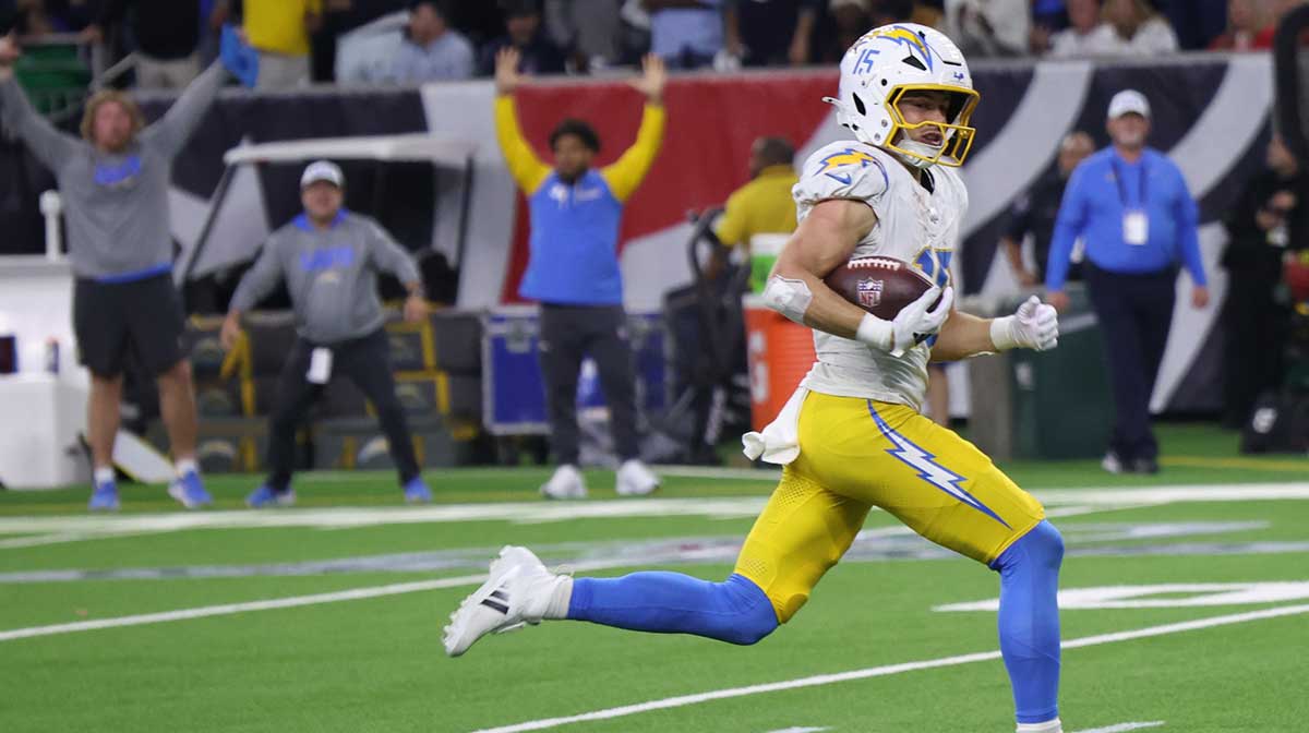 Los Angeles Chargers wide receiver Ladd McConkey (15) scores on a pass in the fourth quarter against the Houston Texans in an AFC wild card game at NRG Stadium.