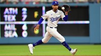 Los Angeles Dodgers shortstop Mookie Betts (50) fields the ground ball of Minnesota Twins third baseman Royce Lewis (23) during the sixth inning at Dodger Stadium. Rojas