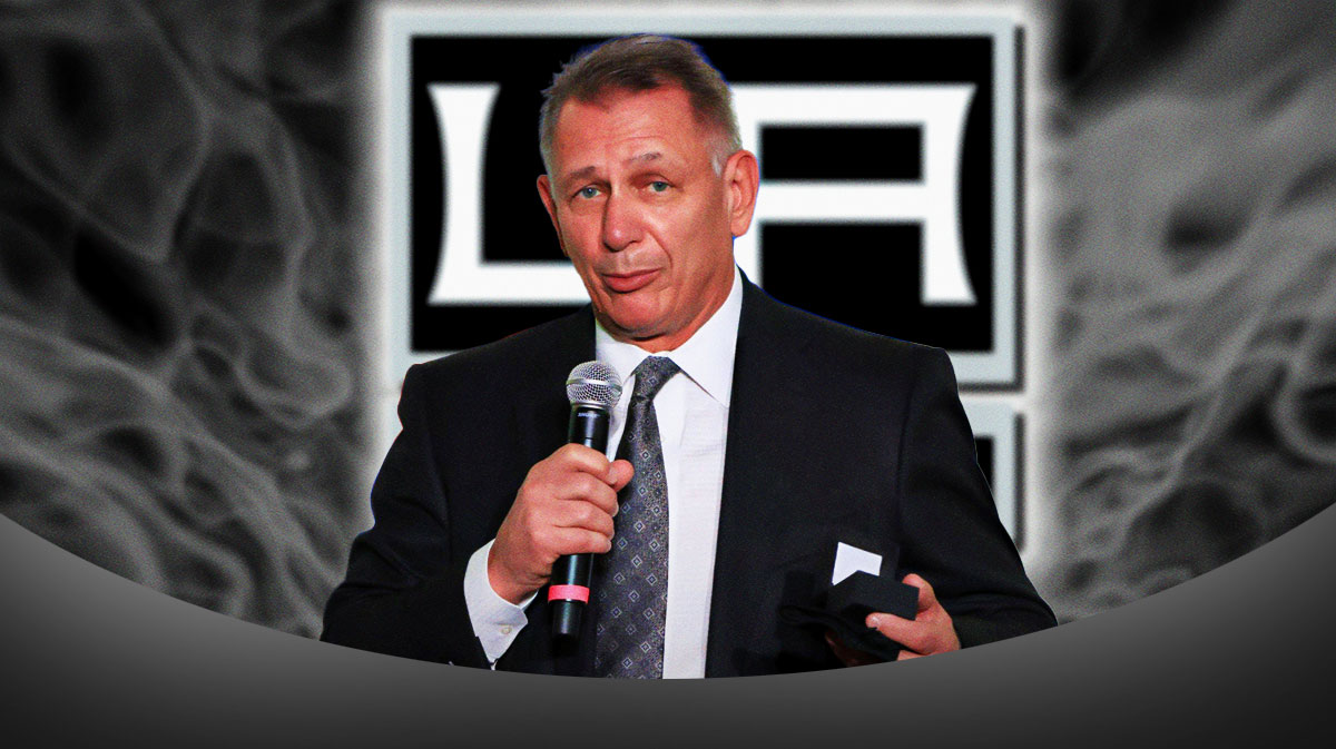 Ken Holland next to LA Kings logo