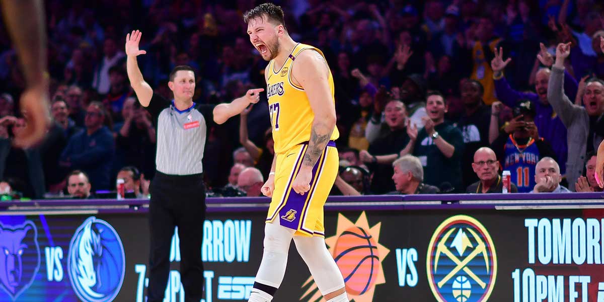 Los Angeles Lakers guard Luka Doncic (77) reacts after scoring a basket against the New York Knicks during overtime at Crypto.com Arena.