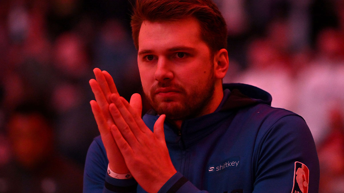 Dallas Mavericks guard Luka Doncic (77) rubs his hands during pre-game ceremonies before playing against the Toronto Raptors at Scotiabank Arena.