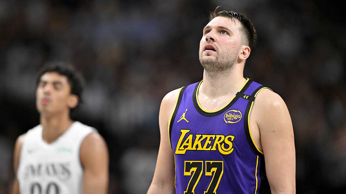 Dallas Mavericks guard Max Christie (00) and Los Angeles Lakers guard Luka Doncic (77) during the game between the Dallas Mavericks and the Los Angeles Lakers at American Airlines Center.