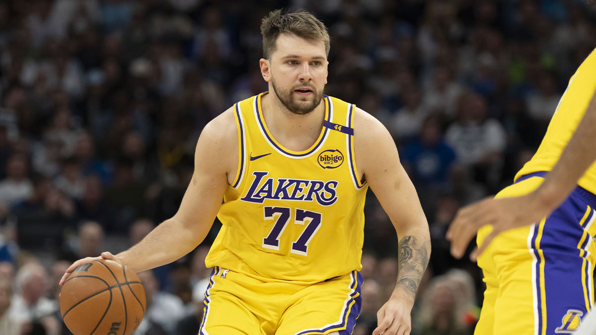 Los Angeles Lakers guard Luka Doncic (77) dribbles the ball against the Minnesota Timberwolves during game three of first round for the 2024 NBA Playoffs at Target Center.