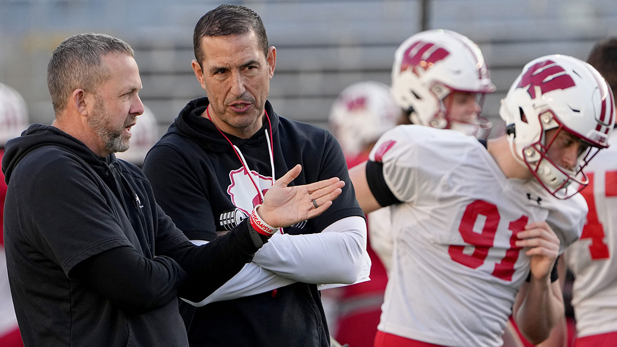 Wisconsin defensive coordinator Mike Tressel, left, talks with head coach Luke Fickell during practice Tuesday, April 11, 2023 at Camp Randall Stadium in Madison, Wis.