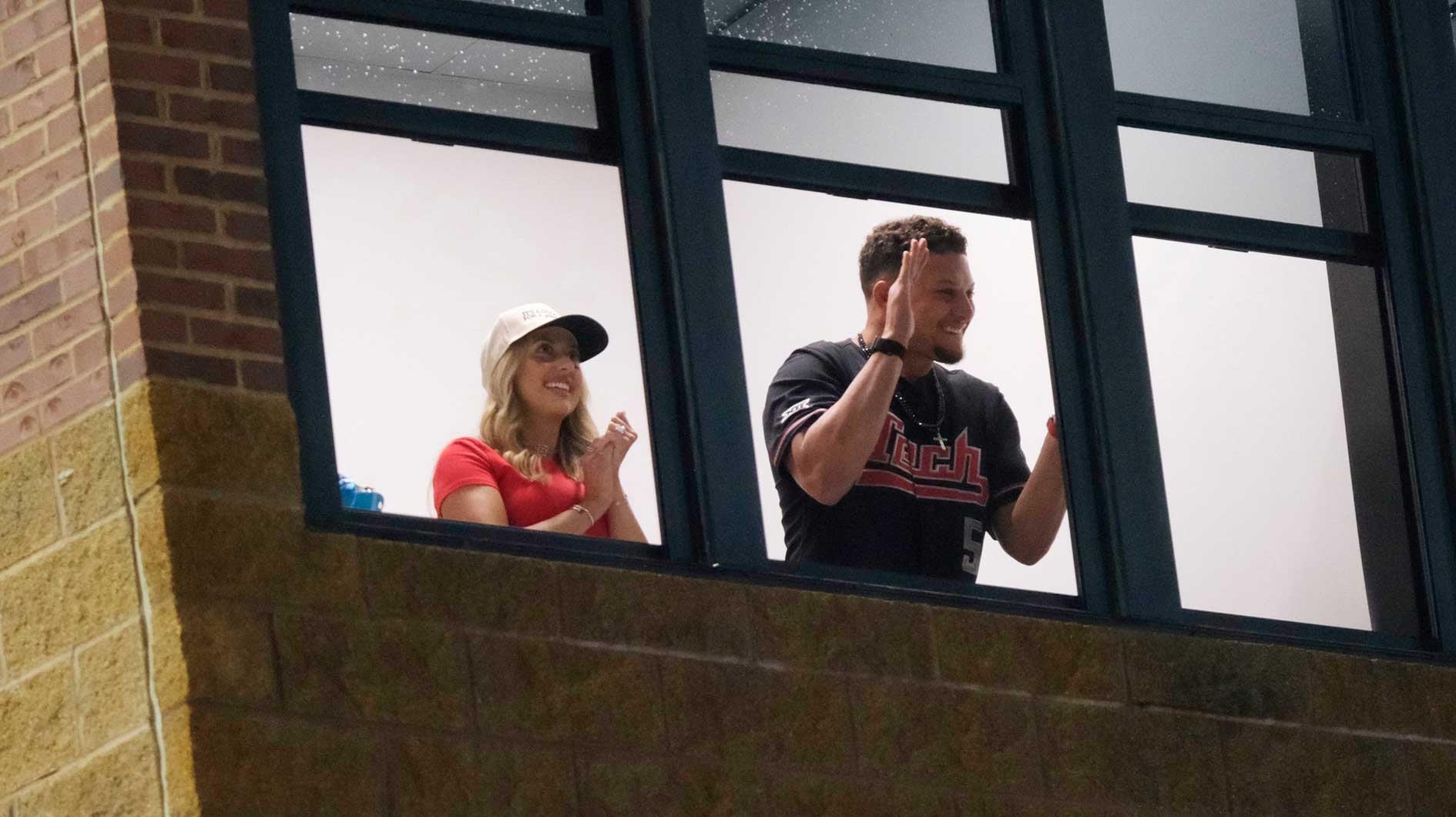 Patrick Mahomes and his wife Brittany cheer as Texas Tech takes control of the game in Game 2 of the Women's College World Series championship series between the Texas Longhorns at Texas Tech Red Raiders at Devon Park in Oklahoma City, Thursday, June 5, 2025. Texas Tech won 4-3.