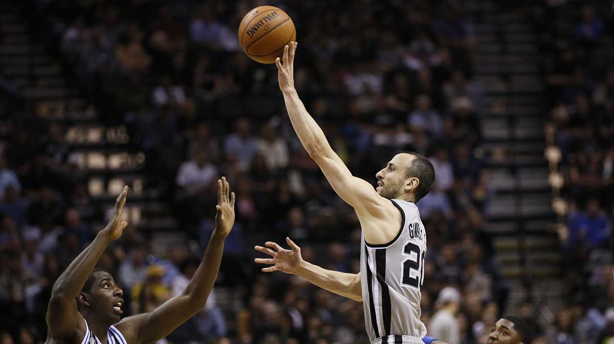 San Antonio Spurs guard Manu Ginobili (20) shoots the ball over Orlando Magic forward Andrew Nicholson (44) during the first half at AT&T Center.