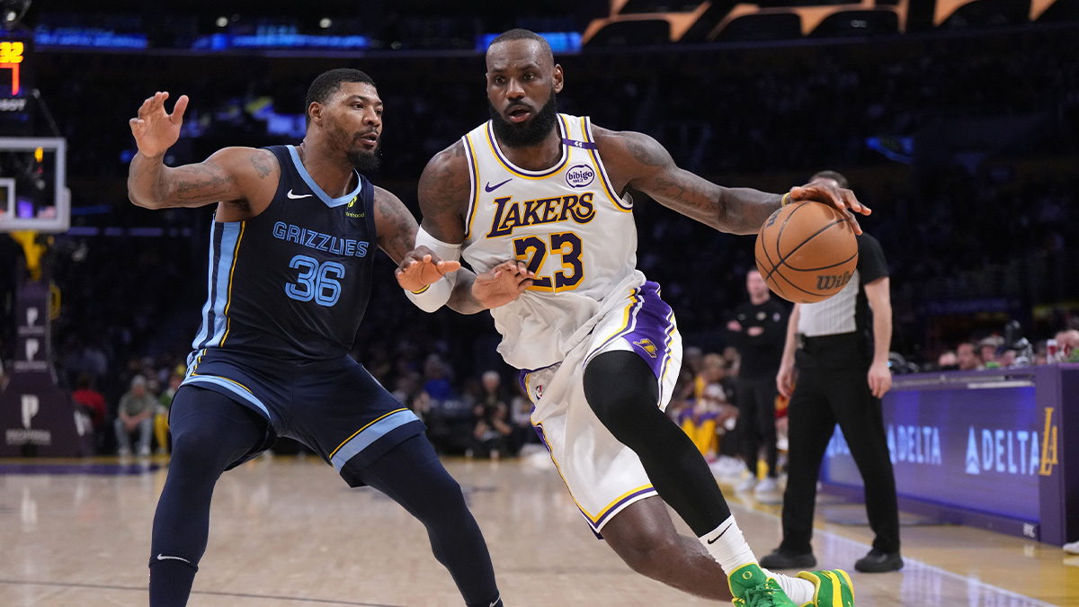 Los Angeles Lakers forward LeBron James (23) dribbles the ball against Memphis Grizzlies guard Marcus Smart (36) at Crypto.com Arena.