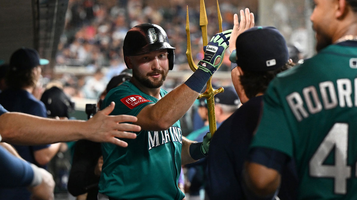 Seattle Mariners designated hitter Cal Raleigh (29) celebrates in the dugout after hitting a grand slam home run against the Detroit Tigers in the ninth inning at Comerica Park.