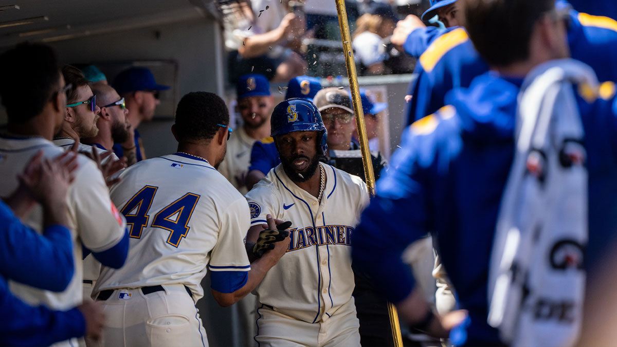 Seattle Mariners Randy Arozarena (56) celebrates in the dugout after hitting a solo home run during the sixth inning against the Pittsburgh Pirates at T-Mobile Park.