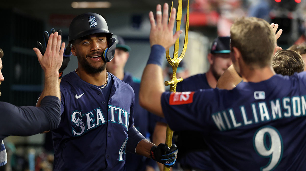 Seattle Mariners center fielder Julio Rodriguez (44) celebrates with teammates after hitting a home run during the sixth inning against the Los Angeles Angels at Angel Stadium.