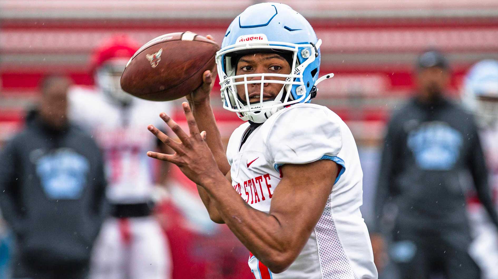 Delaware State quarterback Marqui Adams (5) looks for an open receiver during the Red-White intrasquad spring football game at Alumni StadiumÊin Dover on April 12, 2025.