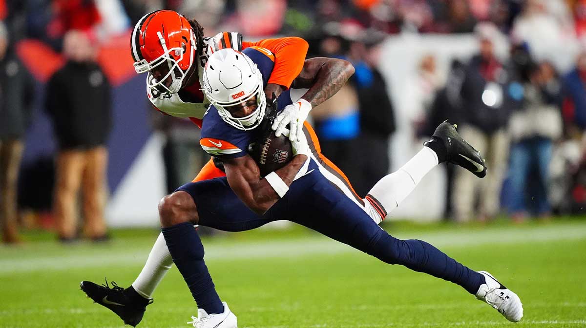 Cleveland Browns cornerback Martin Emerson Jr. (23) tackles Denver Broncos wide receiver Courtland Sutton (14) in the first quarter at Empower Field at Mile High.