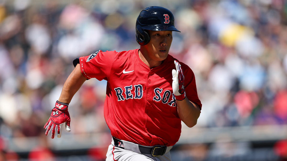 Boston Red Sox outfielder Masataka Yoshida (7) runs to first base against the New York Yankees in the first inning during spring training at George M. Steinbrenner Field.