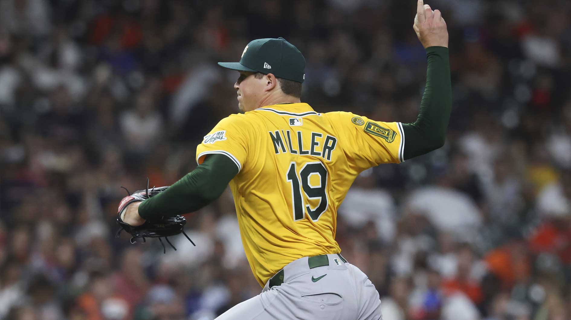 Athletics pitcher Mason Miller (19) delivers a pitch during the eighth inning against the Houston Astros at Daikin Park.