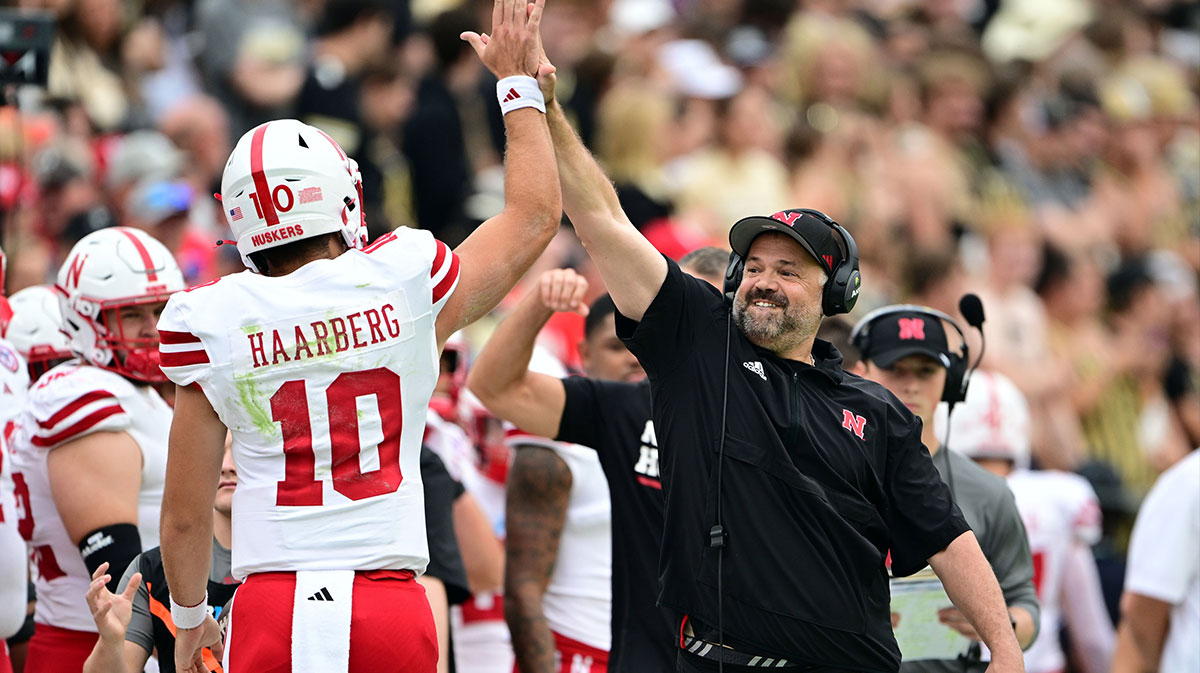 Nebraska Cornhuskers head coach Matt Rhule high fives quarterback Heinrich Haarberg (10) during the first quarter against the Purdue Boilermakers at Ross-Ade Stadium.