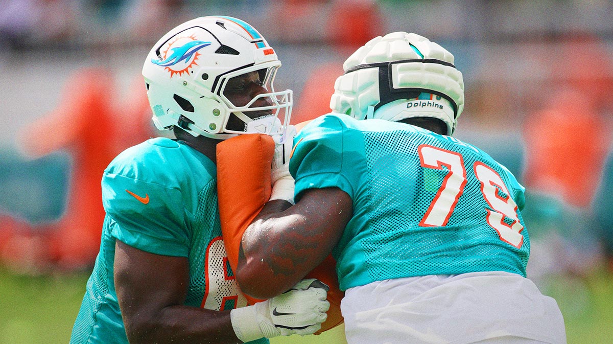 Miami Dolphins guard Matthew Jones (62) works out with offensive tackle Bayron Matos (79) during a joint practice with the Atlanta Falcons at Baptist Health Training Complex.