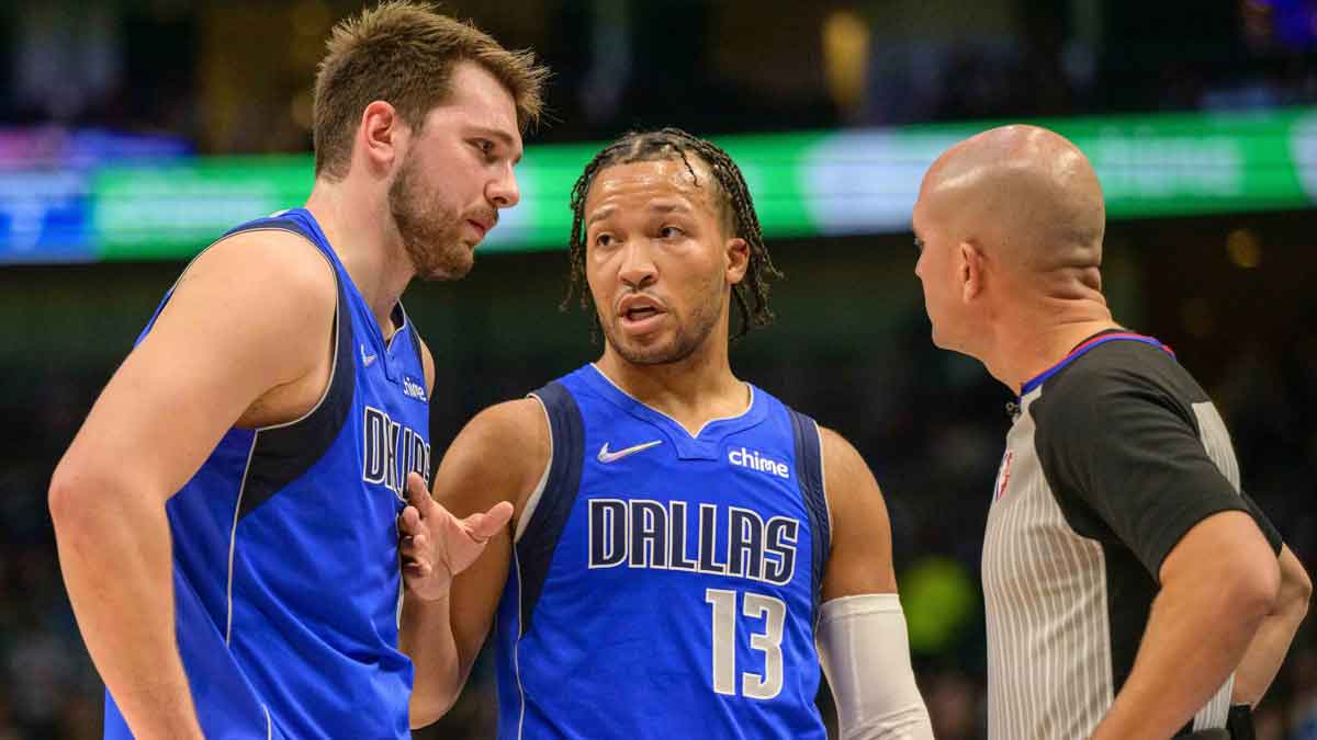 Mavericks guard Luka Doncic (77) and guard Jalen Brunson (13) talk