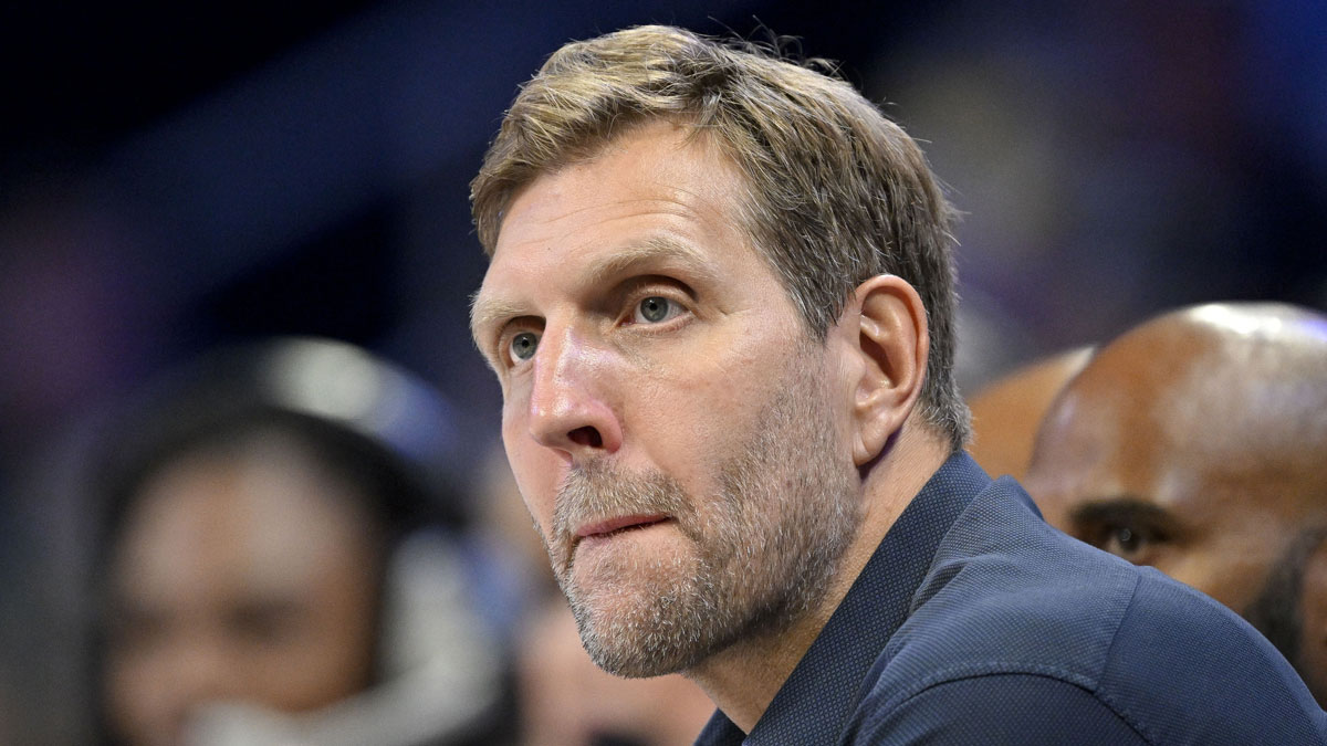 Former Mavericks Dirk Nowitzki watches the game between the Dallas Wings and the Seattle Storm during the first half at College Park Center