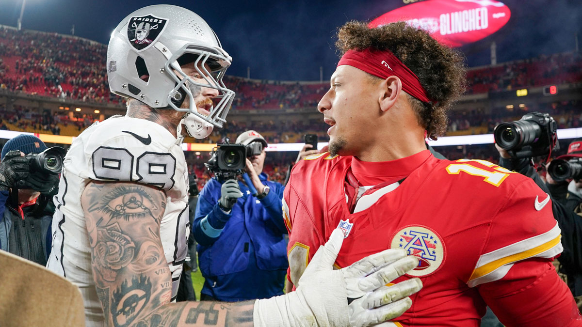 Kansas City Chiefs quarterback Patrick Mahomes (15) greets Las Vegas Raiders defensive end Maxx Crosby (98) after the game at GEHA Field at Arrowhead Stadium.