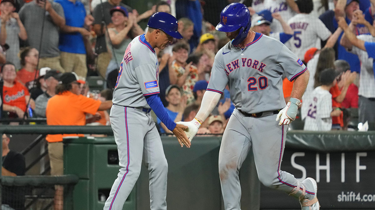 New York Mets first baseman Pete Alonso (20) greeted by coach Mike Sarbaugh (88) following his two run home run during the eighth inning against the Baltimore Orioles Oriole Park at Camden Yards.