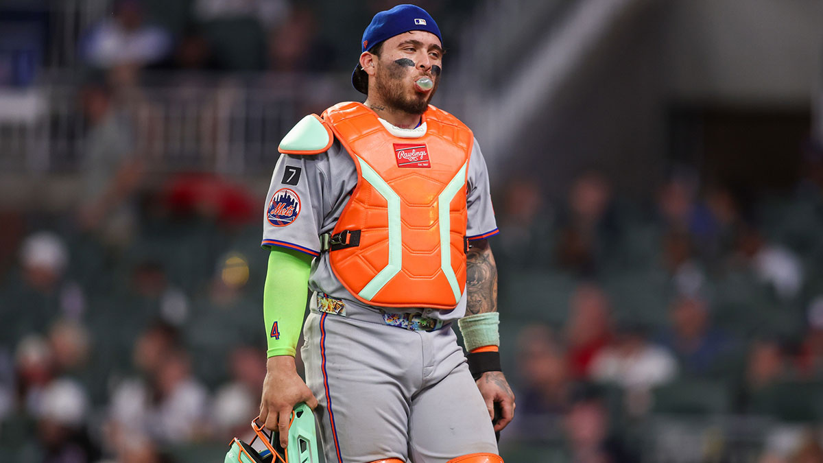 New York Mets catcher Francisco Alvarez (4) walks to the dugout against the Atlanta Braves in the eighth inning at Truist Park.