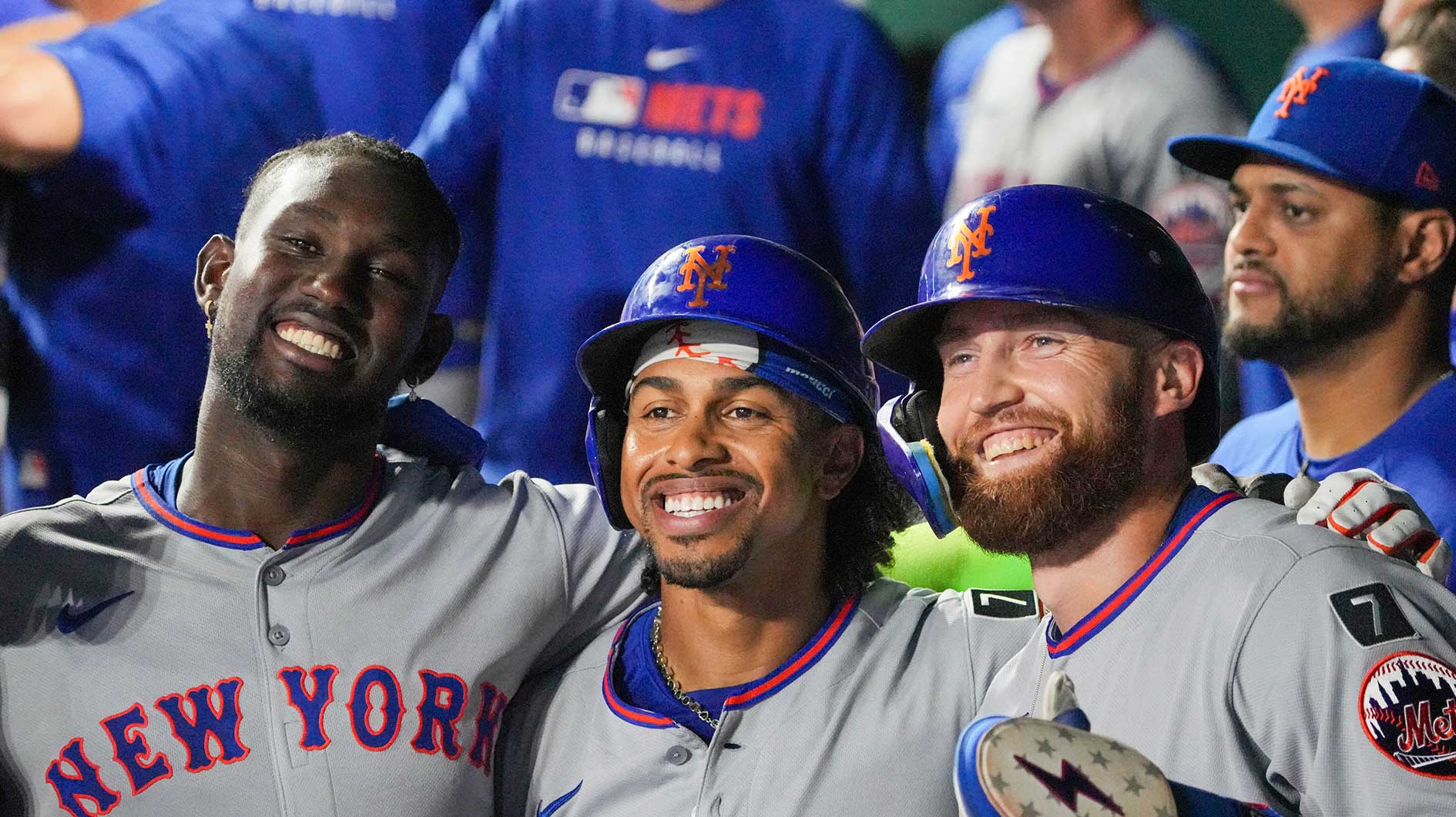 Mets third baseman Ronny Mauricio (10) and shortstop Francisco Lindor (12) and left fielder Brandon Nimmo (9) pose