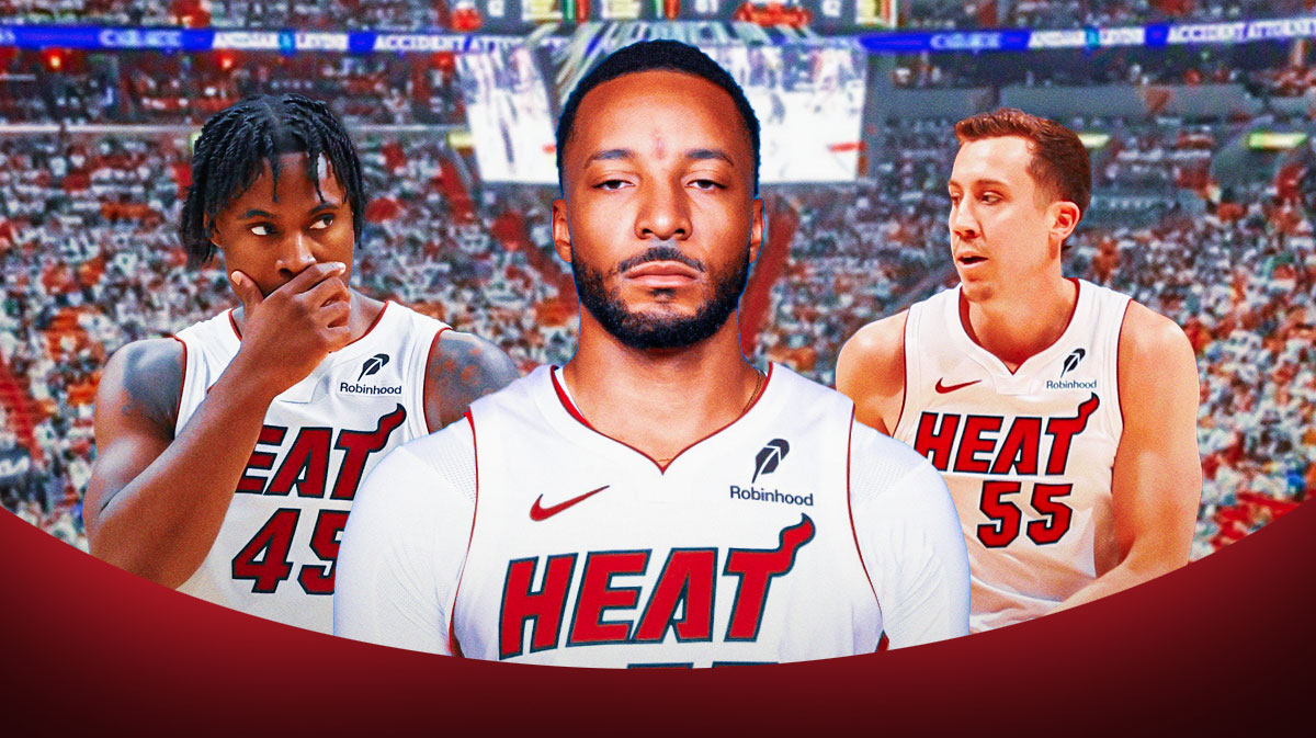 Miami Heat star Norman Powell in an unnumbered Heat jersey in the center with Davion Mitchell and Duncan Robinson on either side in front of Kaseya Center.