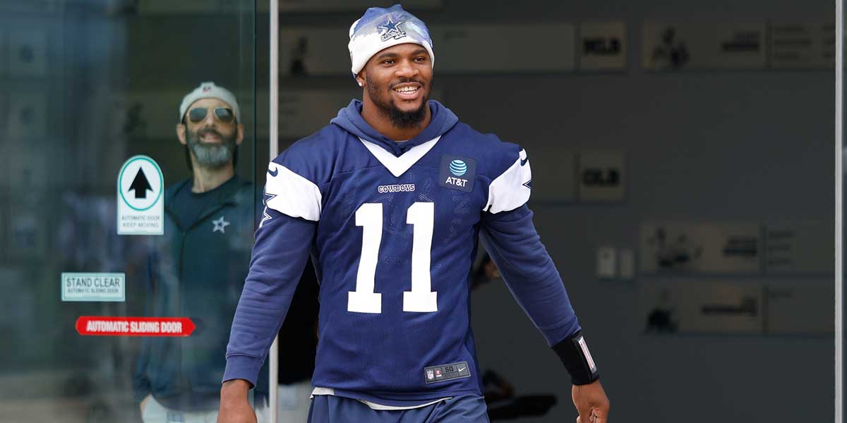 Dallas Cowboys defensive end Micah Parsons (11) walks onto the practice field at the Ford Center at the Star Training Facility in Frisco, Texas.
