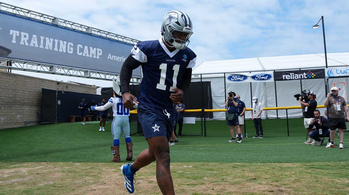Dallas Cowboys defensive end Micah Parsons (11) enters the field during training camp at the River Ridge Fields.