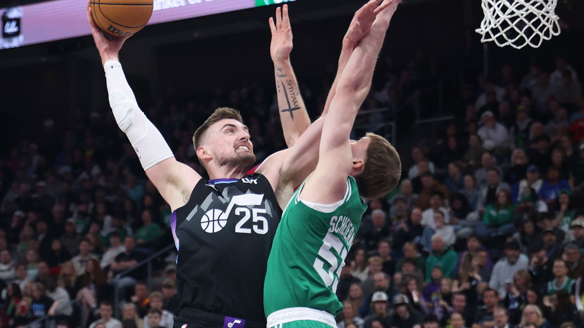 Utah Jazz center Micah Potter linked with Washington Wizards (25) goes for a dunk against Boston Celtics forward Baylor Scheierman (55) during the second half at Delta Center.